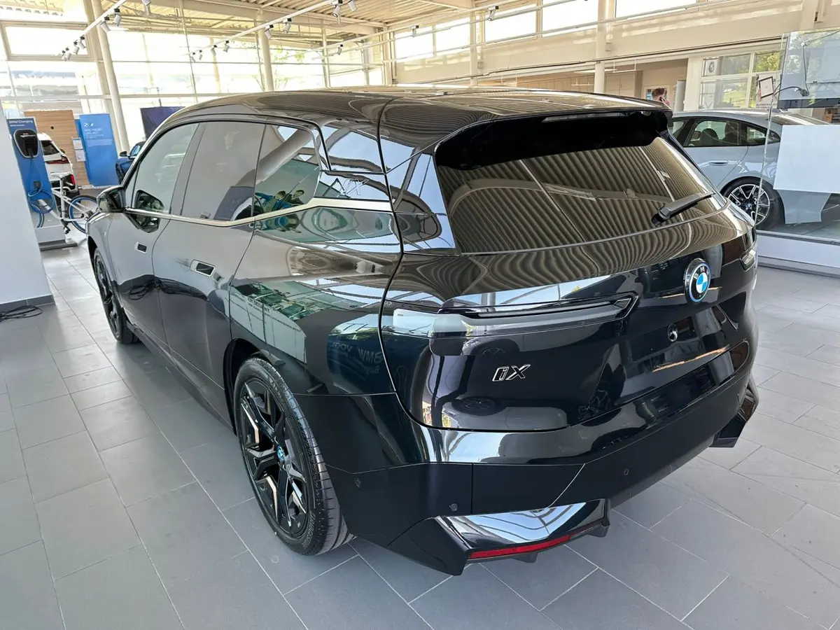 BMW IX M60 2023, rear view — Priveo Cars, Europe